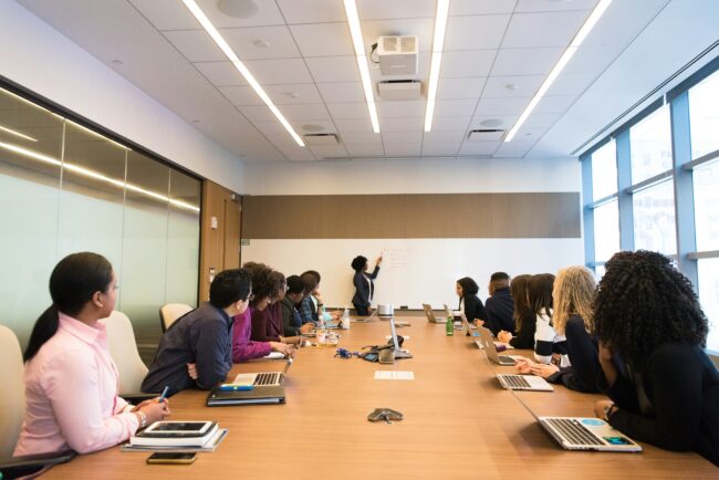 A stock image of a group of women in a boardroom 