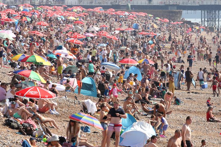 Thousands of sun-seekers and sunbather enjoy a late summer heat wave at Brighton seafront in the United Kingdom in September 2023.
