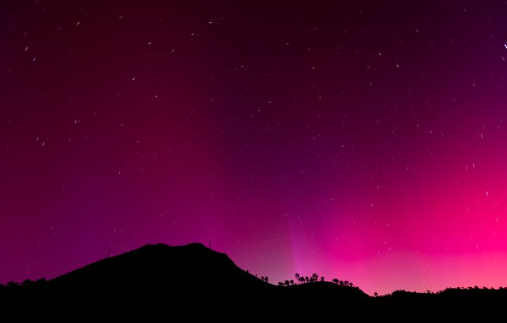 The northern lights visible over Lake Berryessa, California, near midnight on Saturday 11, 2024. 