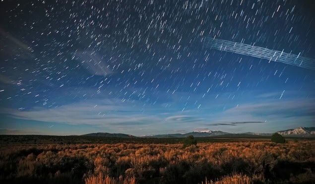 Starlink satellites photographed over Carson National Forest