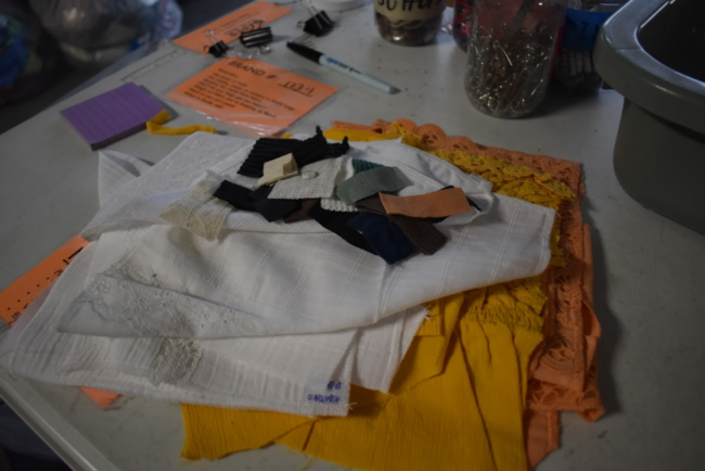 Sorted textile scraps on a table